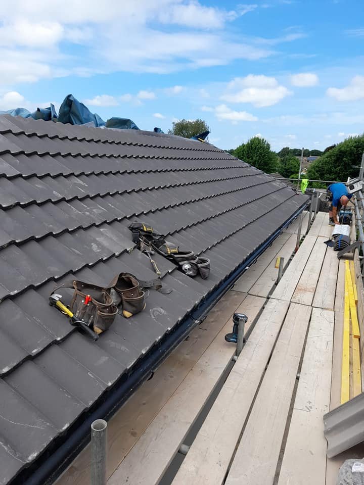 Roofing team at work